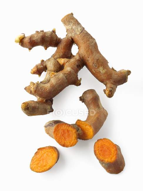Closeup top view of fresh Turmeric roots on white background — Stock Photo