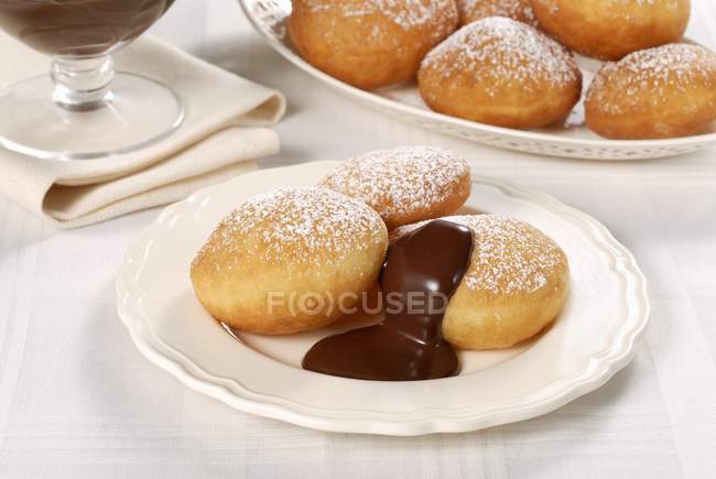 Italian doughnuts with chocolate sauce — Stock Photo