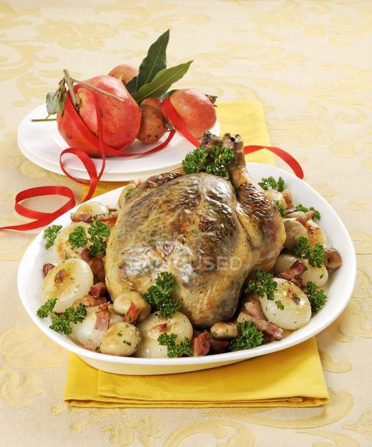 Capon with potatoes on plate — Stock Photo