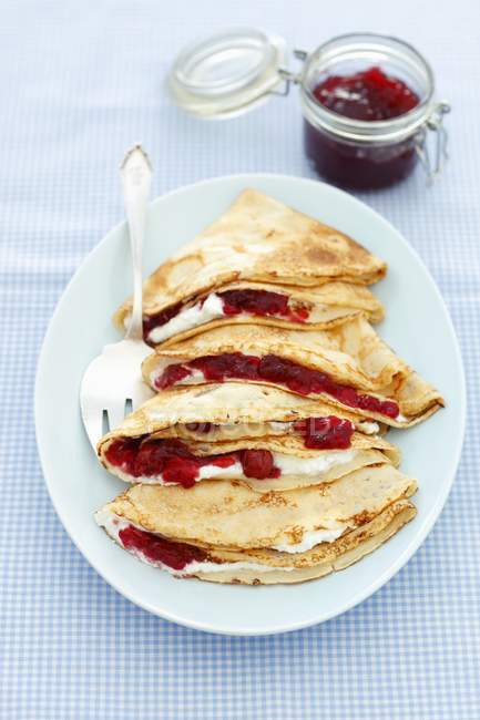 Pancakes with cherry jam — Stock Photo