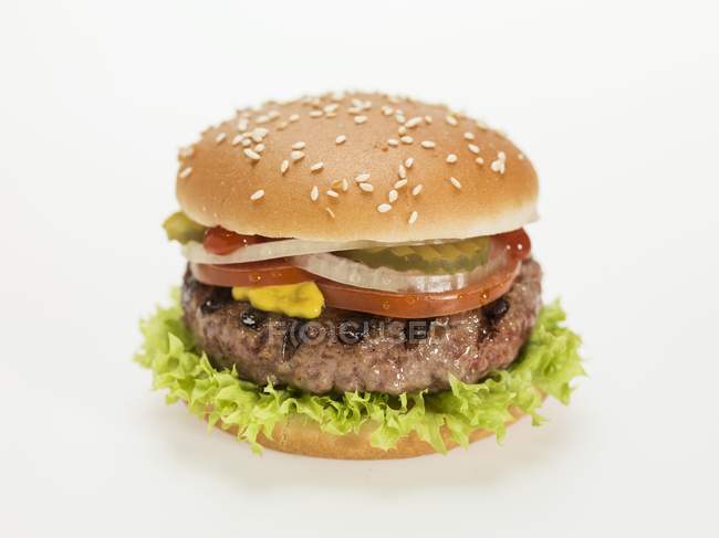 Hamburger with tomato on white — Stock Photo