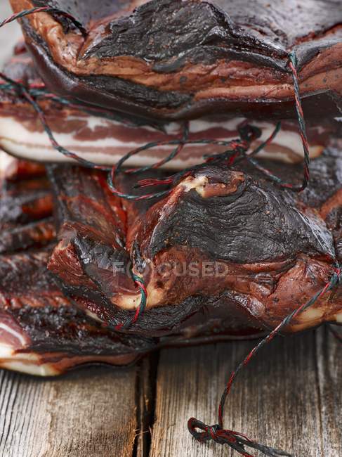 Closeup view of dry-cured smoked ham — Stock Photo