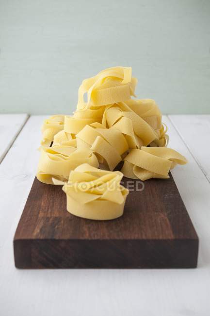 Pappardelle dry uncooked pasta nests — Stock Photo