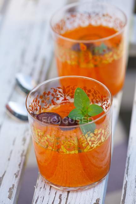 Glasses of Gazpacho with olives — Stock Photo