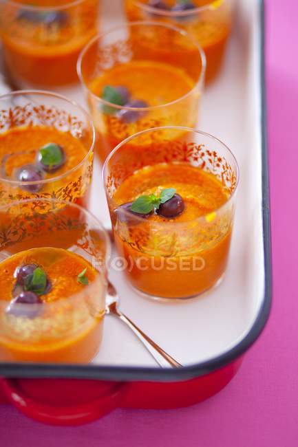 Gazpacho with olives in glasses — Stock Photo