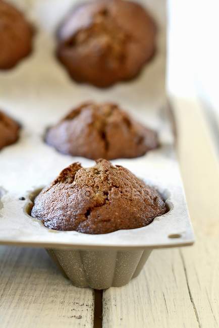 Baking tin of coffee muffins — Stock Photo