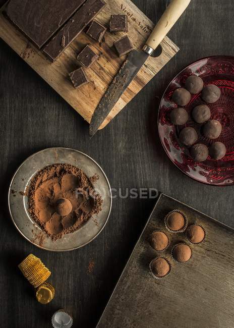 Chocolate truffles on wood — Stock Photo