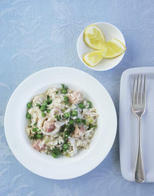 Risotto with fish and peas — Stock Photo