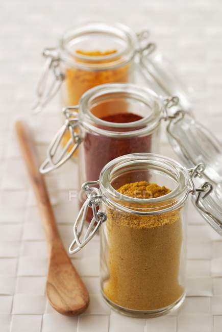 Closeup view of small glass jars of spices — Stock Photo