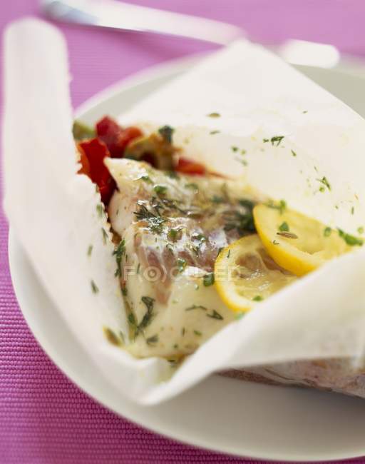 Cod and vegetable papillote — Stock Photo