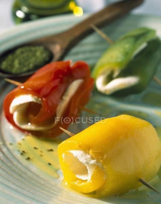 Rolls of peppers laying on plate — Stock Photo