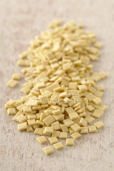 Closeup elevated view of Crozets flat square-shaped pasta — Stock Photo