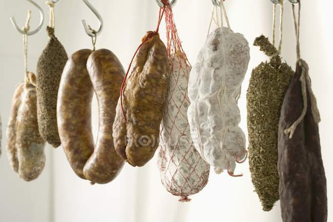 Dried sausages hanging — Stock Photo
