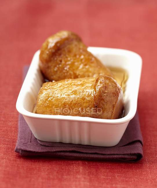 Rum baba in bowl — Stock Photo