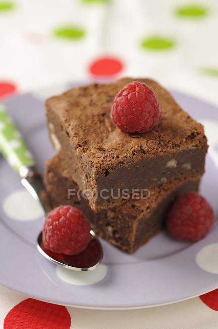 Brownie serving with raspberries — Stock Photo