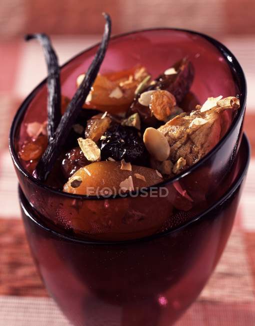 Closeup view of stewed dried fruit with vanilla pods — Stock Photo
