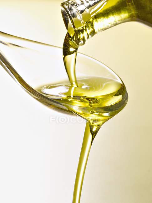 Spoonful of organic and healthy olive oil — Stock Photo