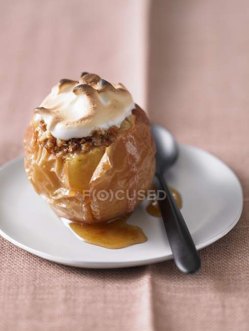 Baked apple topped with meringue — Stock Photo