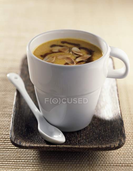 Cream of pumpkin in cup — Stock Photo