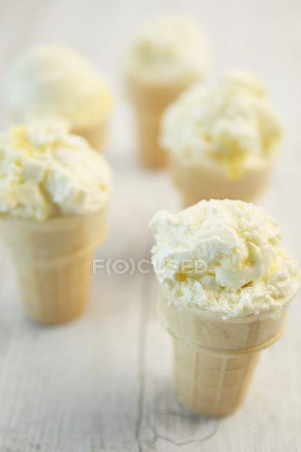 Lemon meringue ice cream in cones — Stock Photo