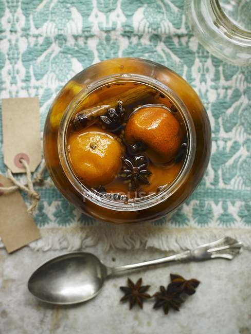 Closeup top view of preserved Clementines in glass jar — Stock Photo