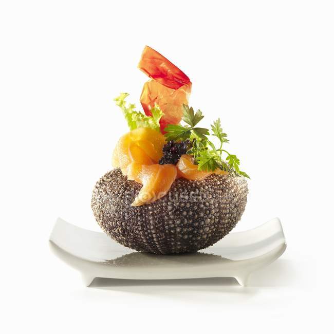 Urchin with salmon and fish roe — Stock Photo