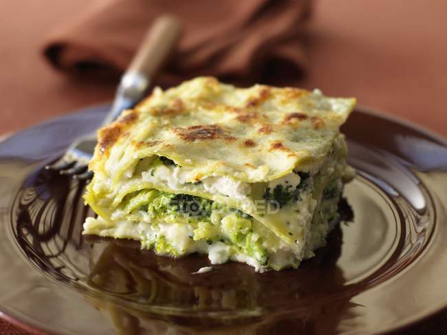 Piece of lasagne with romanesco cabbage — Stock Photo