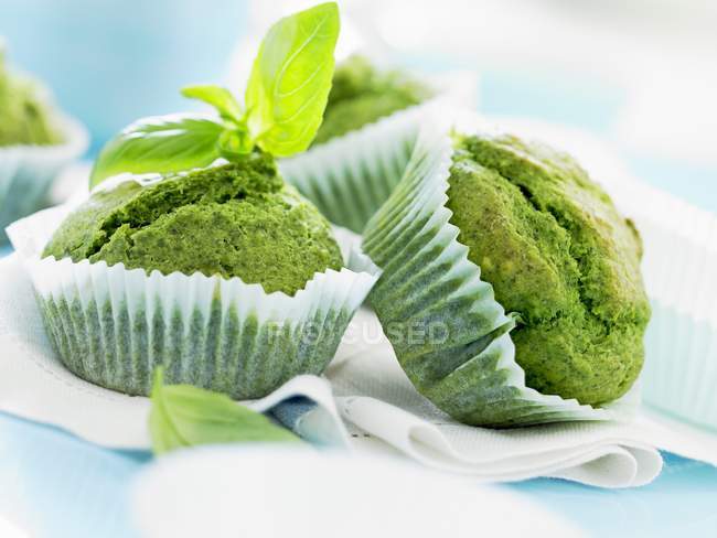 Pesto muffins with basil leaves — Stock Photo