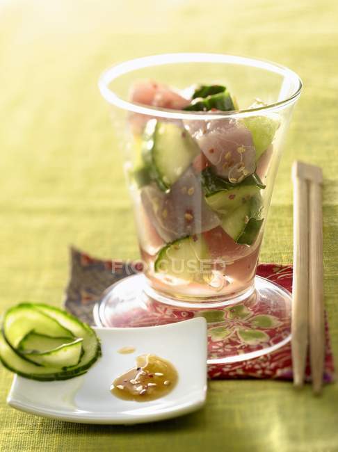 Red tuna and cucumber tartare with sesame seeds — Stock Photo