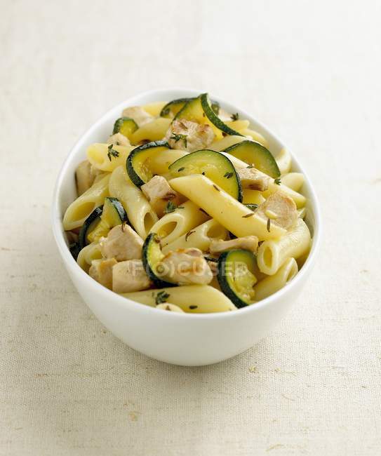 Penne pasta with rabbit and zucchini — Stock Photo