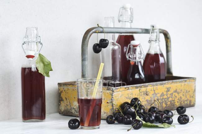 Cherry juice in glass — Stock Photo