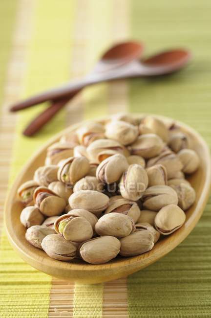 Unshelled pistachios in bowl — Stock Photo