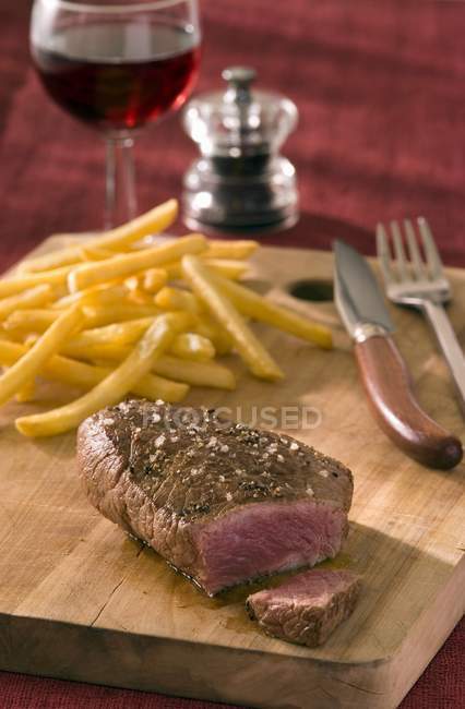 Rump steak with french fries — Stock Photo