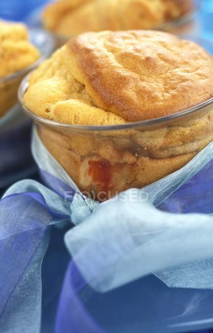Closeup view of lobster and crab souffle in glass dish tied with blue ribbons — Stock Photo