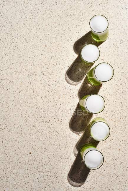 Spring Pea Veloute Shooters with Verbena foam — Stock Photo