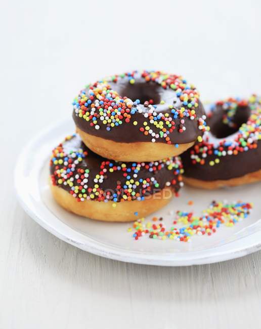Decorated chocolate donuts — Stock Photo