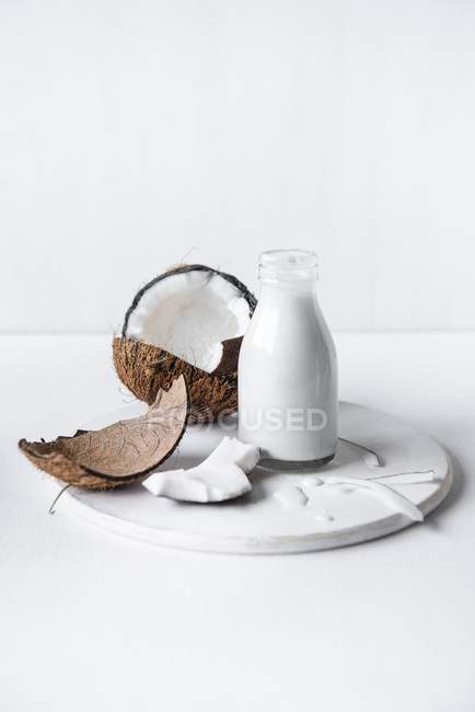 Coconut milk in bottle — Stock Photo