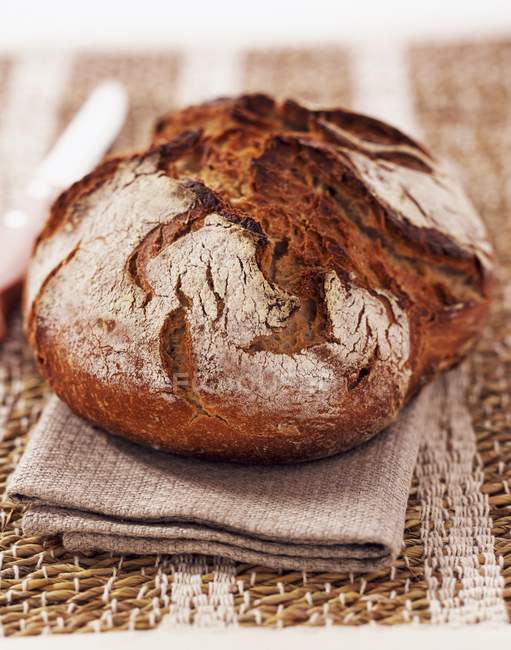 Round freshly baked loaf — Stock Photo