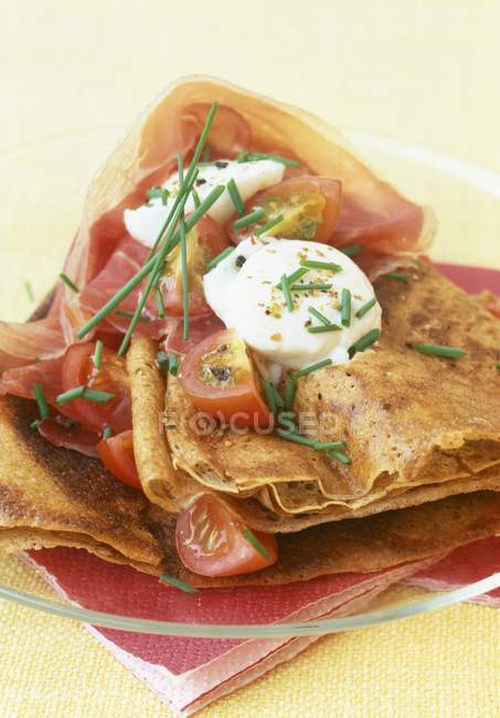 Buckwheat crepes with Parma ham — Stock Photo