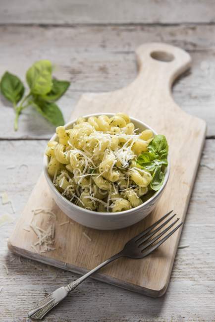 Bowl of cavatappi pasta with basil pesto — Stock Photo