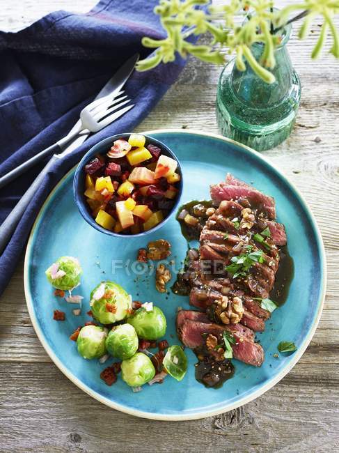 Entrecote with walnuts on plate — Stock Photo