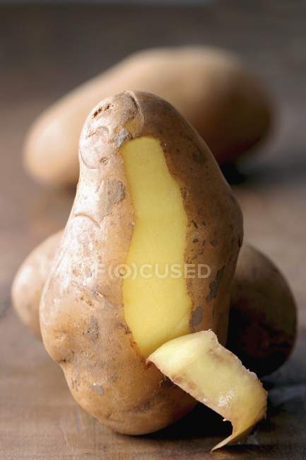 Partly peeled Potato — Stock Photo