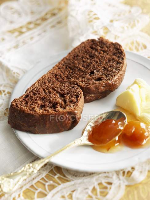 Chocolate brioche on plate — Stock Photo