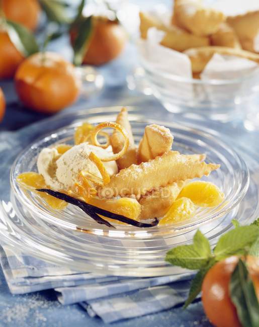 Closeup view of fritters and candied clementines — Stock Photo