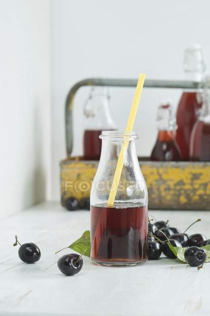 Cherry juice in glass — Stock Photo