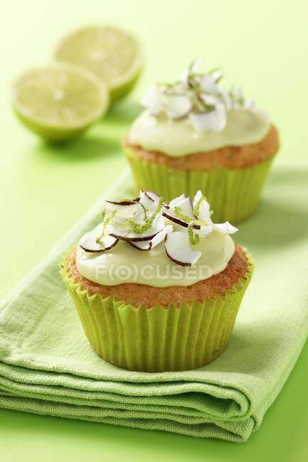 Fresh coconut and lime iced cupcakes — Stock Photo