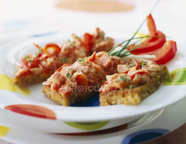 Piperade on toast on plate — Stock Photo