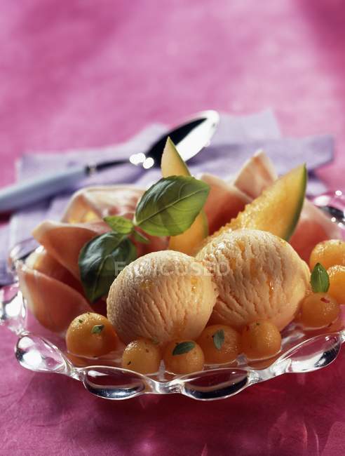 Melon sorbet and parma ham — Stock Photo