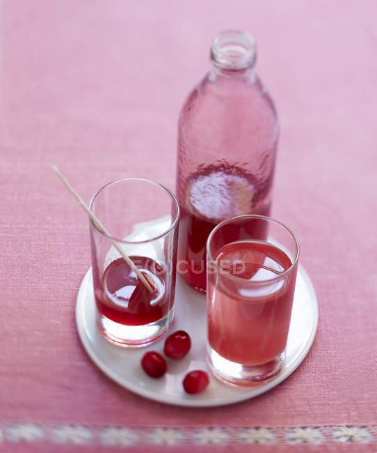 Cranberry cordial in jar — Stock Photo