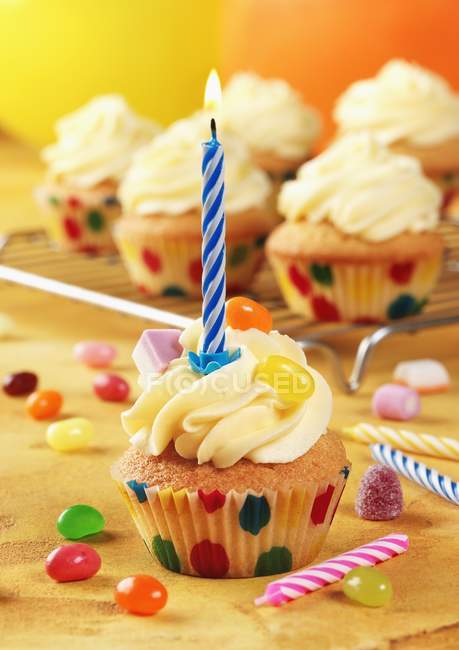 Birthday cupcakes with candles — Stock Photo